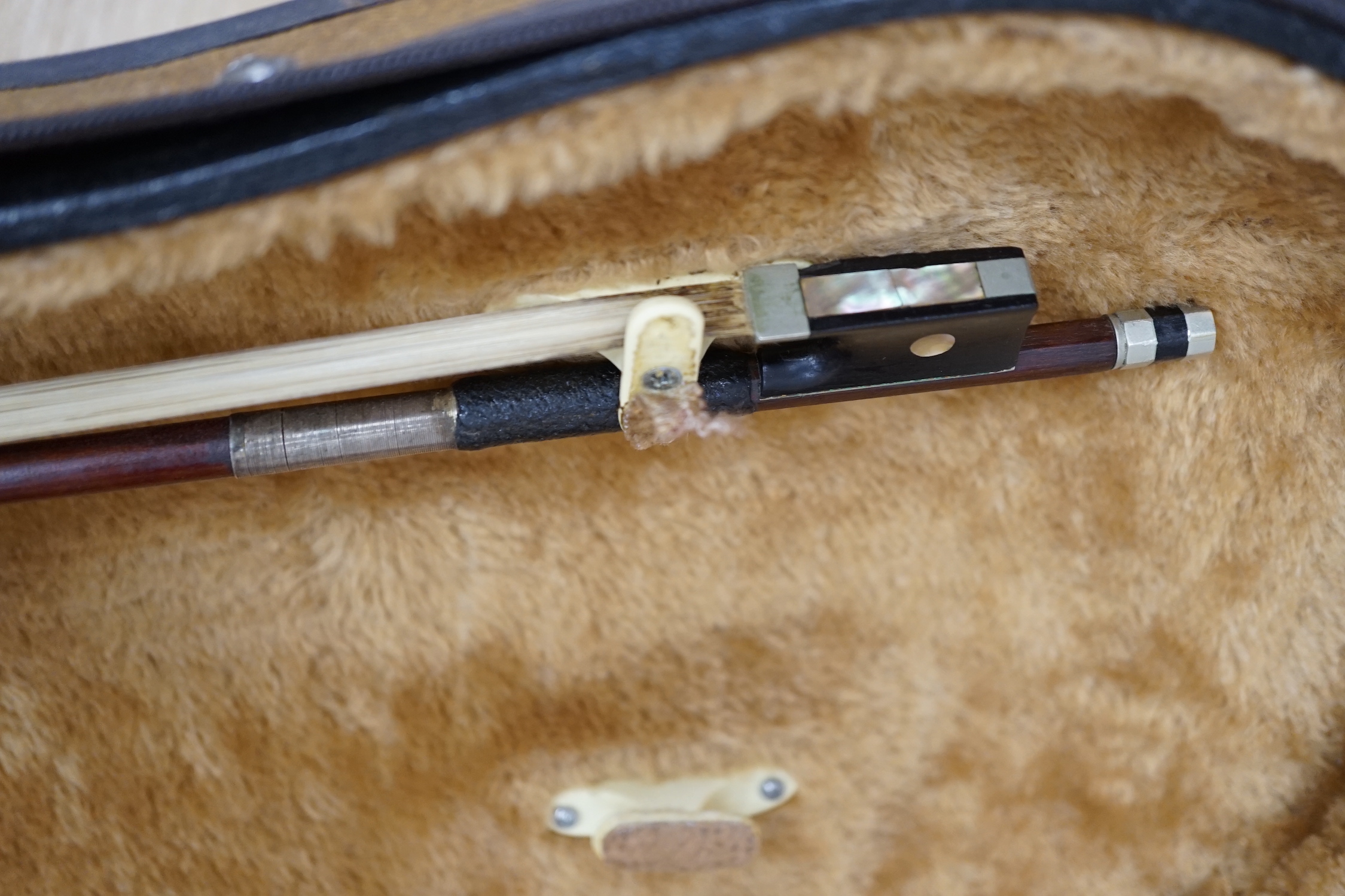 A cased 19th century German violin with paper label for August Hensel, length of body, 36cm, with two bows, CITES submission references, FBHZDSA1 and ZCXXMHV4